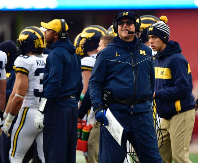 Michigan Wolverines football coach Jim Harbaugh has his club with a current 9-2 record.