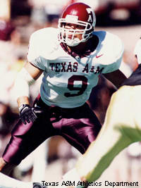 Former Dallas Cowboys linebacker Dat Nguyen is watched by his