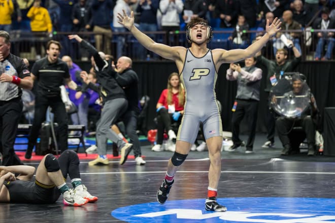 Purdue's Matt Ramos celebrates his stunning upset win over Iowa's Spencer Lee.