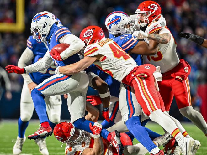 Kansas City Chiefs LB Cole Christiansen (#48) stop Bills Safety Damar Hamlin (#3) while he makes a carry on a fake punt (1/21/24)
