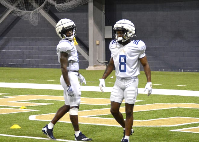 Christian Leary and Malik Rutherford during practice this week in the indoor practice facility 