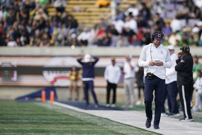 Cal fires offensive coordinator Bill Musgrave and OL coach