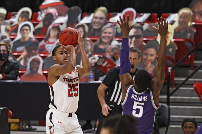 Texas Tech's Nimari Burnett (25) shoots over Kansas State's Rudi Williams (5) during the first half of an NCAA college basketball game Tuesday, Jan. 5, 2021, in Lubbock, Texas.