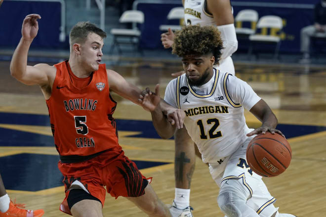 Michigan Wolverines guard Mike Smith drives against Bowling Green