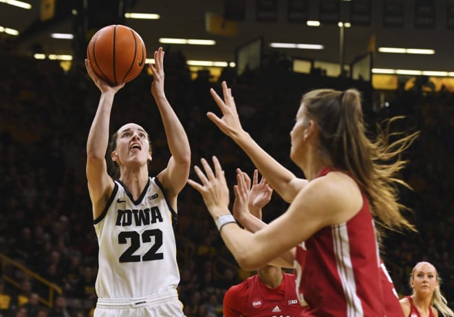 Iowa guard Caitlin Clark (22) shoots against Indiana guard Yarden Garzon (12) during the second half of an NCAA college basketball game Saturday, Jan. 13, 2024, in Iowa City, Iowa. (AP Photo/Cliff Jette)