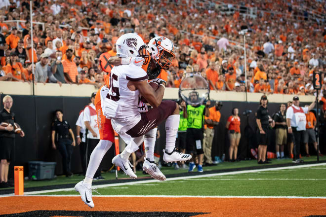 Aug 30, 2018; Stillwater, OK; Missouri State Bears cornerback Zack Sanders (26) intercepts the pass intended for Oklahoma State Cowboys wide receiver Jalen McCleskey (1) during the first half at Boone Pickens Stadium.
