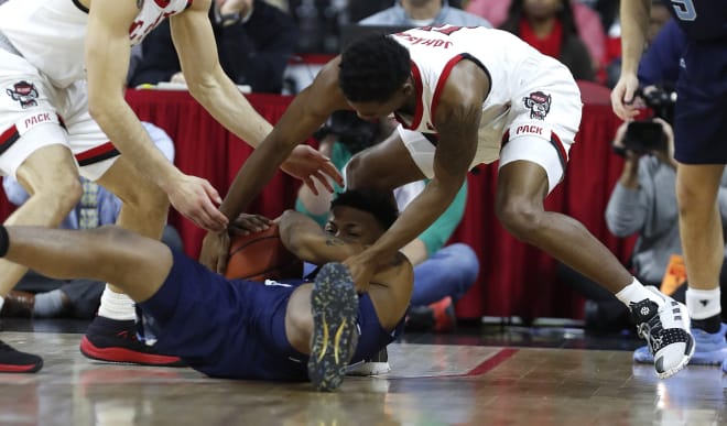 NC State senior point guard Markell Johnson swarms The Citadel's Alex Reed during the Wolfpack's 83-63 win Sunday in Raleigh.