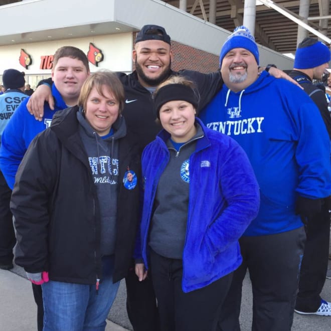 Jacob Hyde with the Deaton family after UK's 41-38 win over Louisville. 