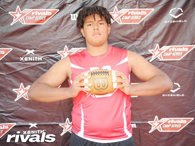 Texas offensive lineman Markis Deal holds a Michigan Wolverines football recruiting offer. 
