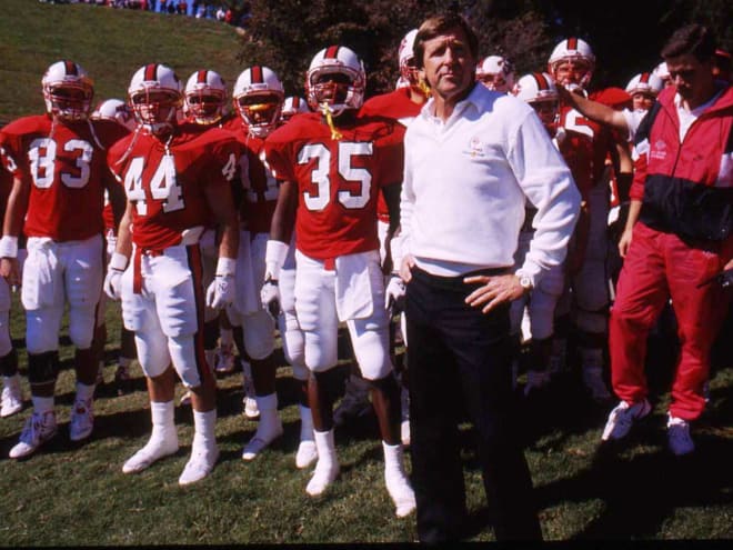 Dick Sheridan (white sweater) was the head coach for NC State when the Wolfpack rolled to a 48-3 win in Chapel Hill in 1988.