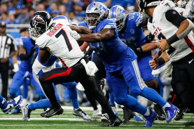 Detroit Lions defensive tackle Alim McNeill (54) tackles Atlanta Falcons running back Bijan Robinson last Sunday.