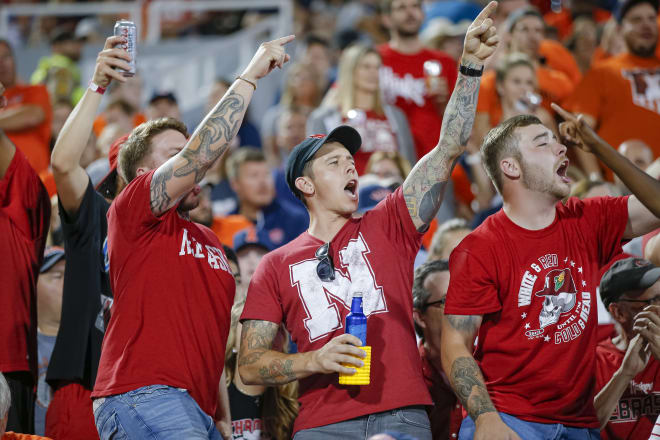 A group of younger Nebraska fans celebrate at Illinois. Champaign is one of several Power Five venues that sells beer in the stadium. 