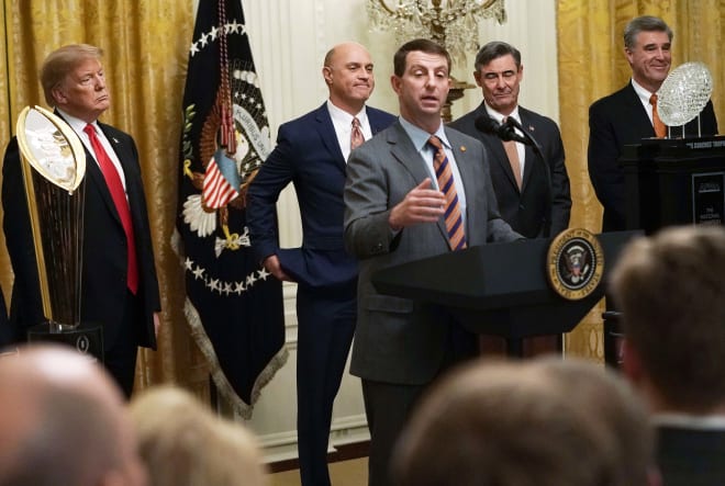 (From L to R): Former President Of The United States Donald J. Trump is shown here at The White House in January of 2019 with Clemson University President James Clements, head coach Dabo Swinney, Clemson Board Of Trustees Chairman E. Smyth McKissick III and Clemson Athletics Director Dan Radakovich.