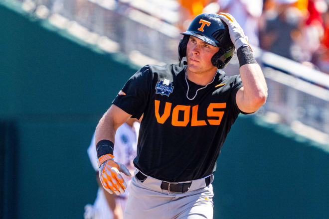 Jun 23, 2024; Omaha, NE, USA; Tennessee Volunteers left fielder Dylan Dreiling (8) circles the bases after hitting a two-run home run against the Texas A&M Aggies during the seventh inning at Charles Schwab Field Omaha. 