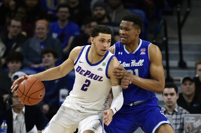 Jaylen Butz #2 of the DePaul Blue Demons takes on Ike Obiagu #21 of the Seton Hall Pirates in the first half at Wintrust Arena