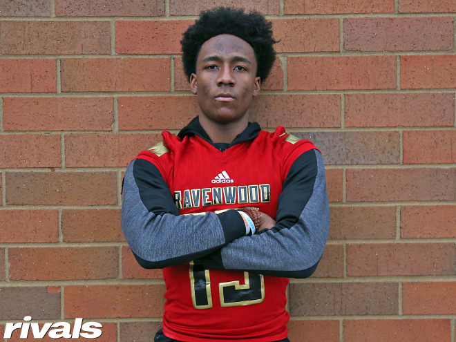 Tennessee defensive back Myles Pollard holds a Michigan Wolverines football recruiting offer from Jim Harbaugh.