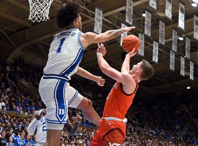 Duke center Dereck Lively II, left, goes up for a shot block against Virginia Tech's Sean Pedulla during Saturday night's game. 