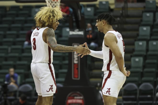 Alabama basketball guards JD Davison, left, and Jaden Shackelford, right, celebrate during a game. Photo | Getty Images