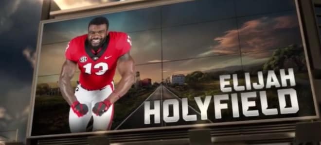 Holyfield's ESPN graphic proves that his arms likely have different zip codes.