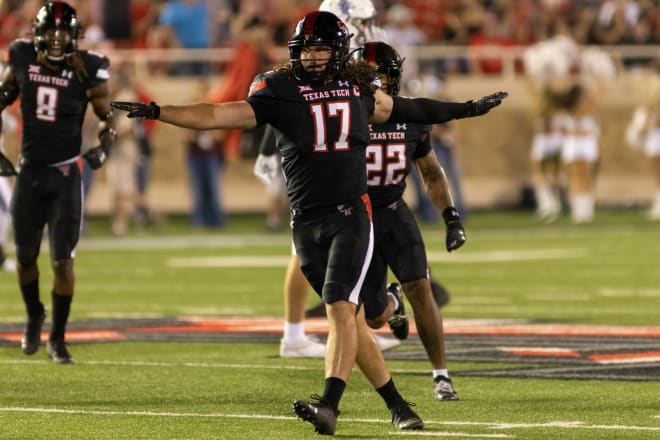 Colin Schooler celebrates on the field after a defensive play against SFA