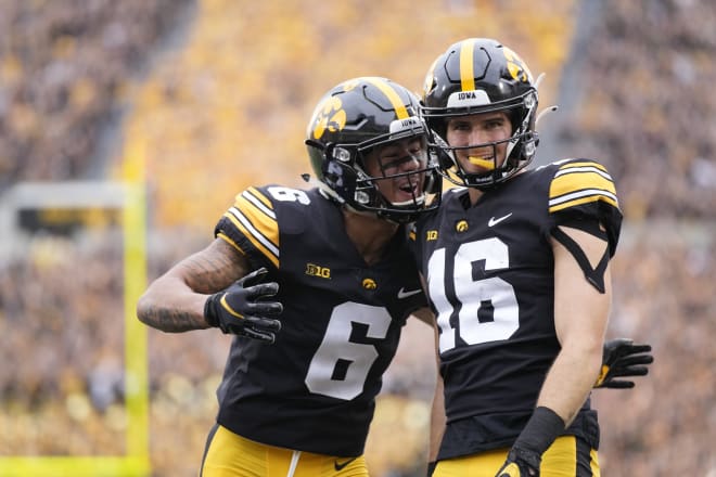 Iowa receivers Keagan Johnson, left, and Charlie Jones 