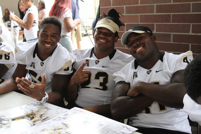 Willie Mitchell (middle) flanked by fellow linebackers Troy Gray and Terrance Plummer during the 2014 Fan Day.