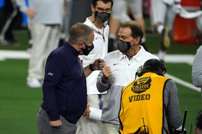 Alabama Crimson Tide head coach Nick Saban and Notre Dame Fighting Irish head coach Brian Kelly meet on the field before the Rose Bowl at AT&T Stadium. Photo | Kirby Lee-USA TODAY Sports