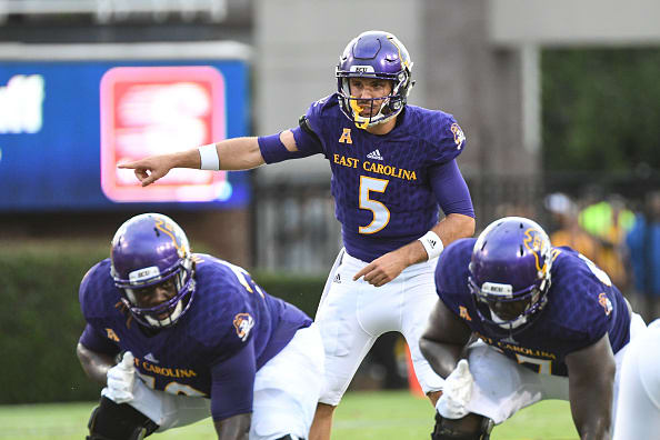 Quarterback Gardner Minshew (5) of the East Carolina Pirates calls a play during a game between the James Madison Dukes and the East Carolina Pirates on September 2, 2017 at Dowdy-Ficklen Stadium in Greenville, NC. Photo | Getty Images