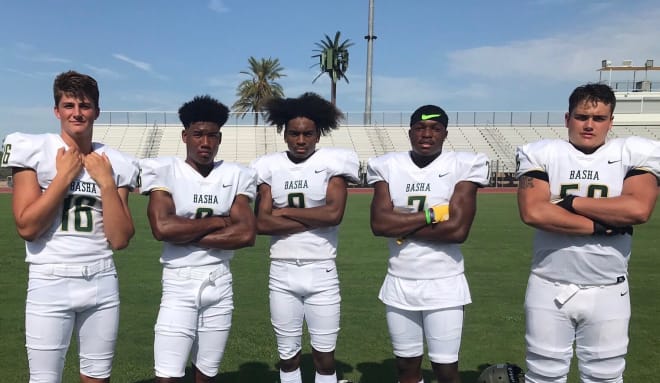 Basha players model their new road white jerseys during Media Day earlier this month.  From left to right: QB Gabe Friend, CB/WR Micah Harper, WR Camden Mateen, RB Andrell Barney, and NG/C James Knos.  (Photo by Cody Cameron)