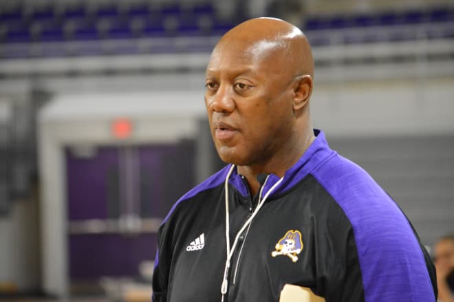ECU lead assistant Mike Perry, pictured today, takes over as the interim head basketball coach of the Pirates.