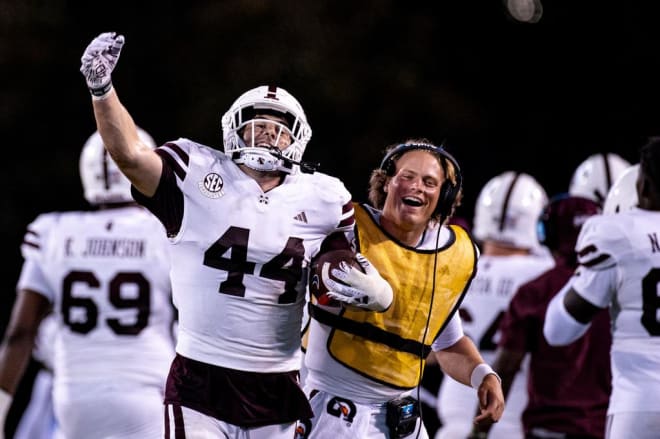 STARKVILLE, MS - September 09, 2023 - Mississippi State Linebacker Jett Johnson (#44) and Mississippi State Quarterback Jake Weir (#15) during the game between the Arizona Wildcats and the Mississippi State Bulldogs.