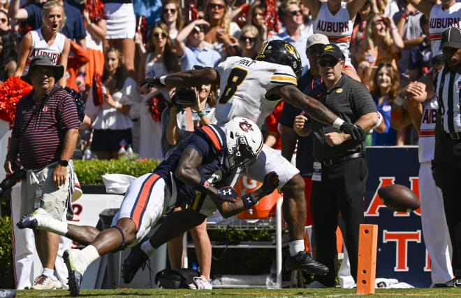 Auburn's Keionte Scott tackles Missouri's running back. 