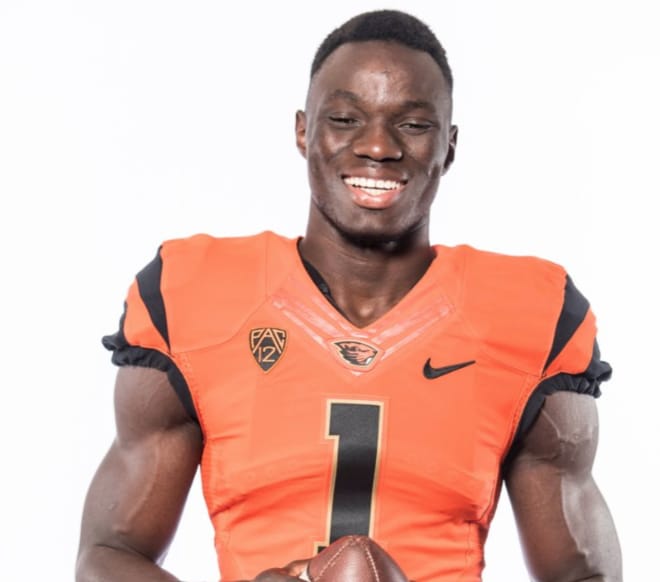 Azur Kamara is all smiles when trying on the OSU jersey
