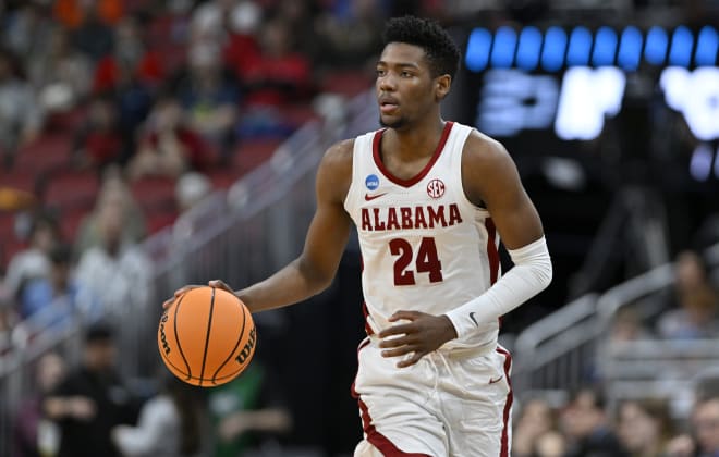Alabama Crimson Tide forward Brandon Miller (24) dribbles during the second half of the NCAA tournament round of sixteen against the San Diego State Aztecs at KFC YUM! Center. Photo |  Jamie Rhodes-USA TODAY Sports