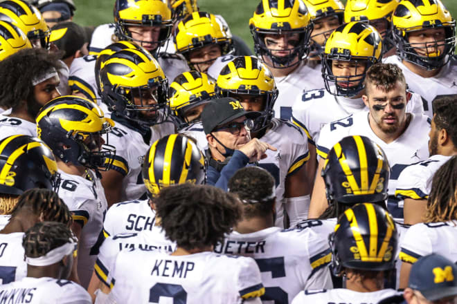 Jim Harbaugh stood at the center of the storm Saturday night and helped guide U-M to victory.