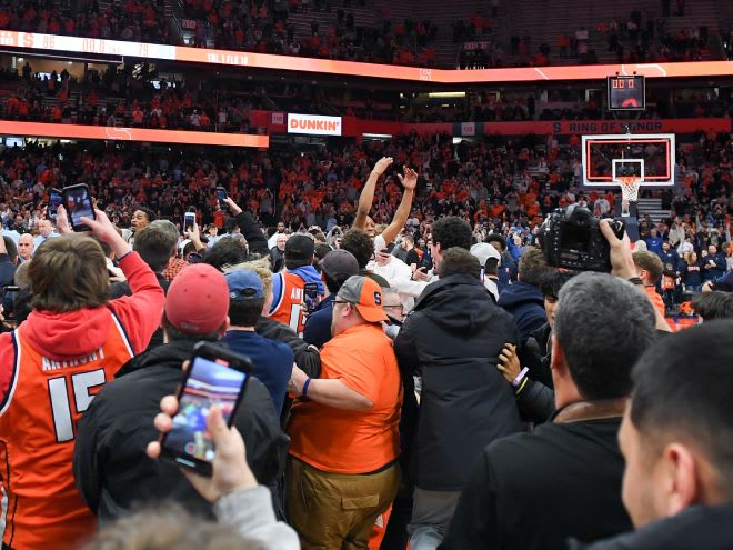 Feb 13, 2024; Syracuse, New York, USA; Fans storm the court following the game between North Carolina Tar Heels and the Syracuse Orange at the JMA Wireless Dome. Mandatory Credit: Rich Barnes-USA TODAY Sports