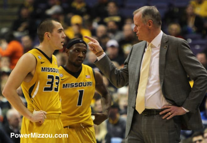 Kim Anderson talks to starting guards Cullen VanLeer and Terrence Phillips 