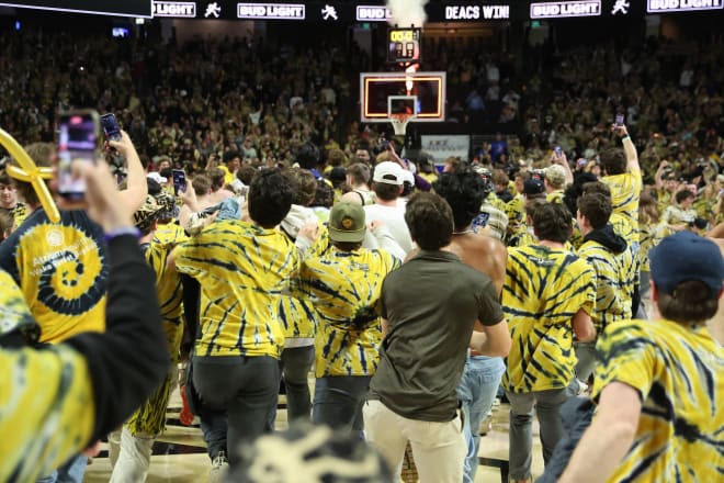 Wake Forest fans rush the court. 
