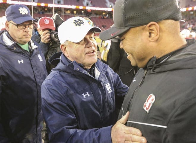 Notre Dame football head coach Brian Kelly with Stanford head coach David Shaw