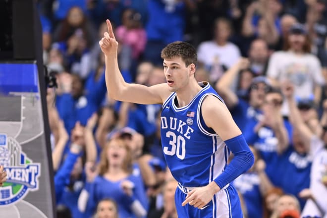 Kyle Filipowski celebrates during the ACC championship. 