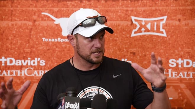 "So Neal saw the ghost. Then he said to her, 'Hey Ghost, you are messing with the wrong person." Then he reached up at the ghost's throat, just like this, and poof! She disappeared. -- Texas coach Tom Herman