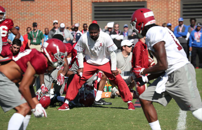 Alabama defensive backs coach Derrick Ansley, middle, watches as his players participate in drills during spring camp. Photo | Alabama Athletics
