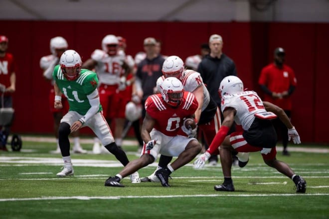 Nebraska safety Marques Buford Jr. preparing to tackle running back Jaquez Yant