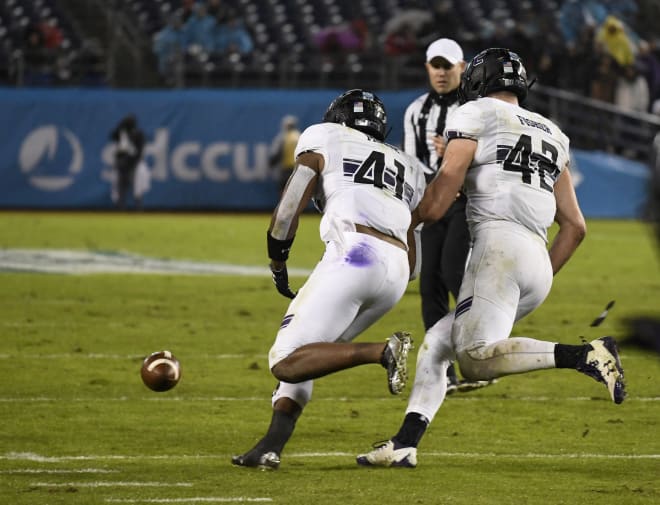 Jared McGee going in to scoop up the fumble he took to the house.