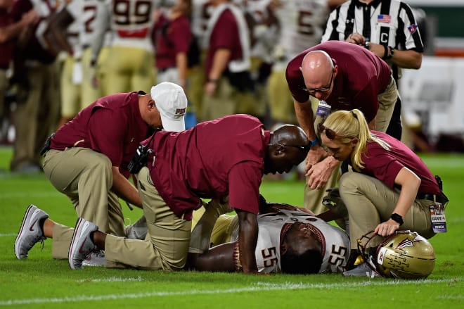 FSU's trainers and medical staff check on defensive lineman Fred Jones during the 2018 season.