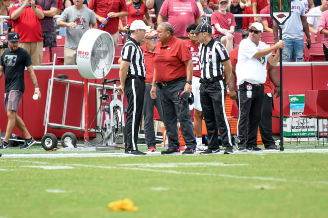 Sam Pittman speaks to officials during Arkansas' win over Rice.