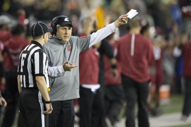 MIke Leach talks with an official during a game this past season 