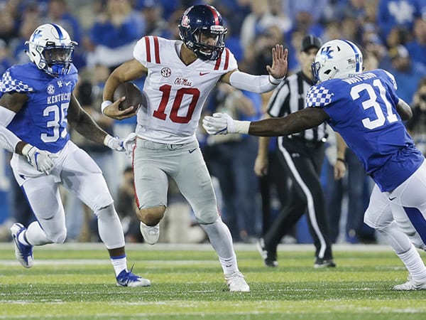 Ole Miss quarterback Jordan Ta'amu looks for extra yardage in a win at Kentucky last November.