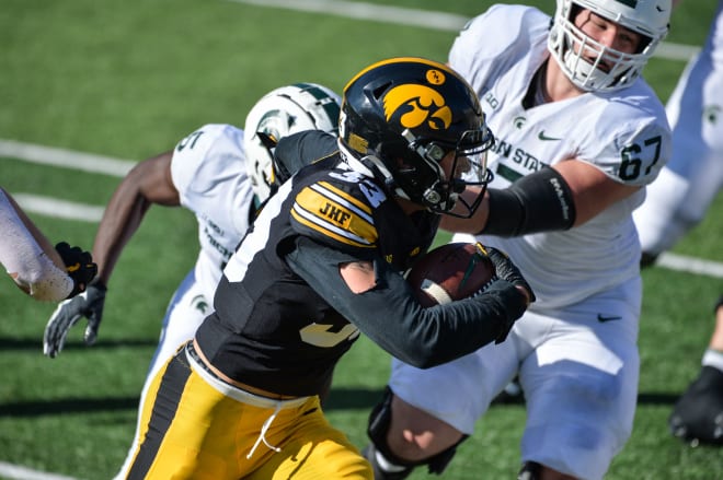 Riley Moss took back and interception for a score in Iowa's win. (Photo: USA Today)