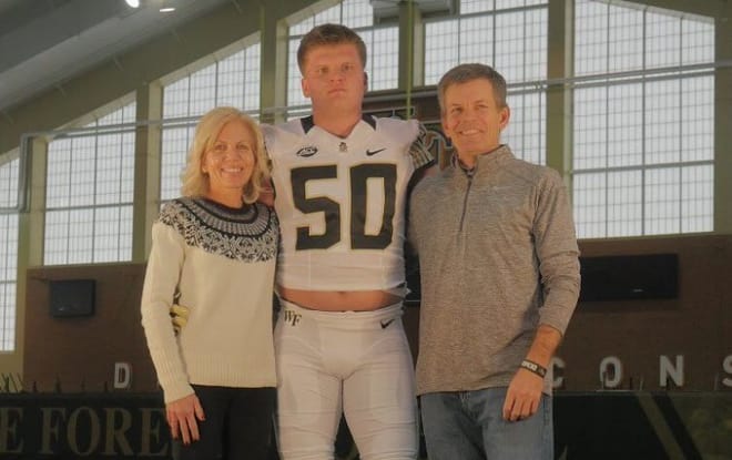 Smart poses with his parents during his official visit